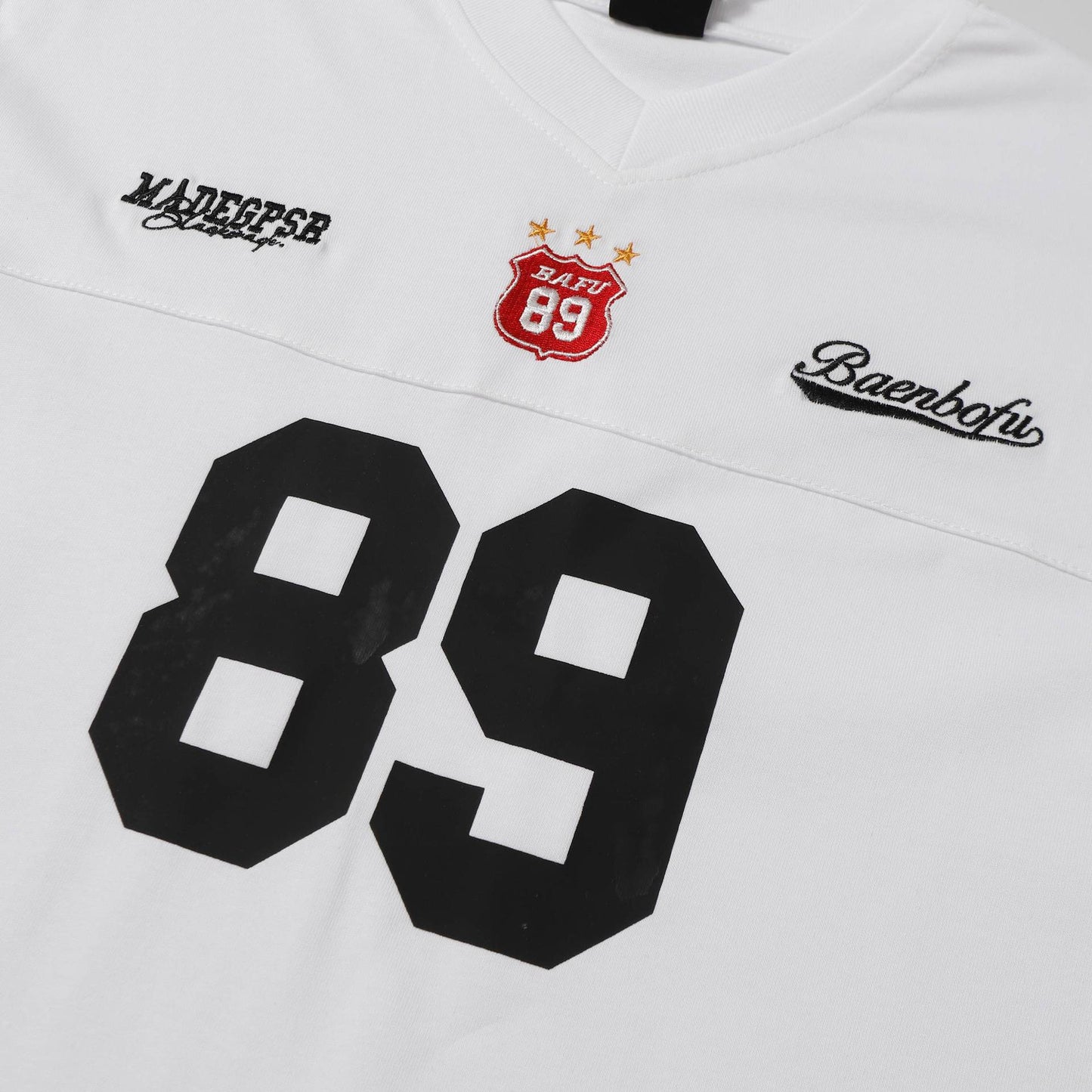 Maglietta uomo stile rugby oversize in cotone con numero frontale disponibile in bianco e nero