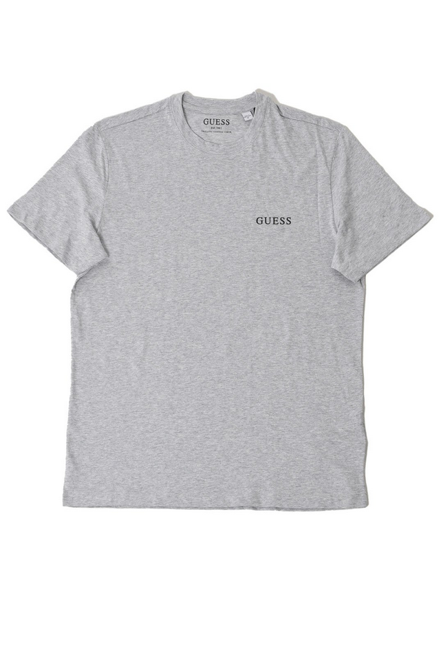 Maglietta Guess Jeans per uomo in cotone grigio con logo stampato, maniche corte e taglio dritto. Comfort e stile per ogni occasione.