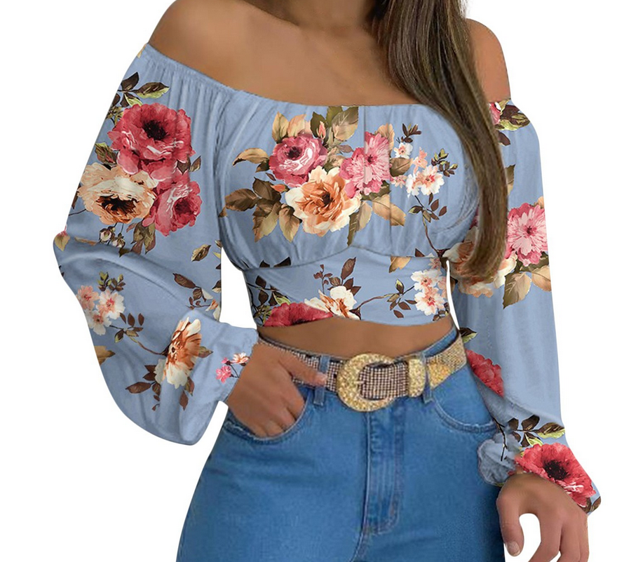 Top elegante a maniche lunghe con cravatta incrociata e spalle scoperte da donna, perfetto per look casual e serate eleganti colore celeste floreale