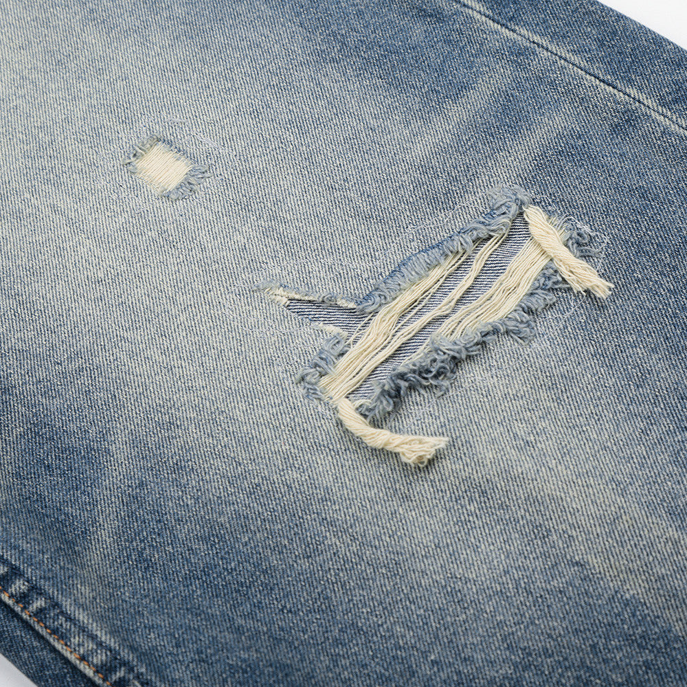 Jeans strappati per uomo di colore classico blu 